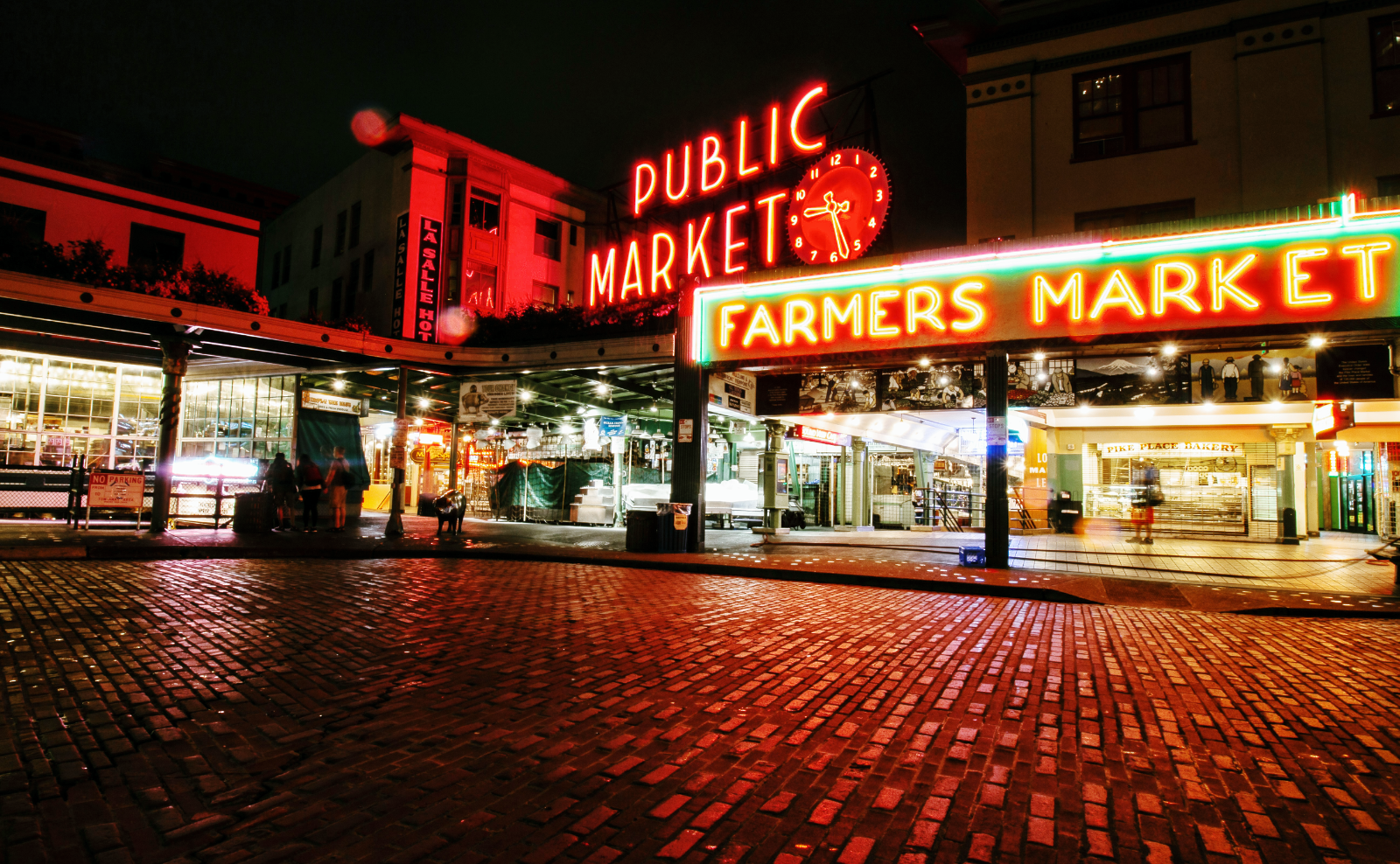 red and green neon signs that read public market farmers market in seattle washington