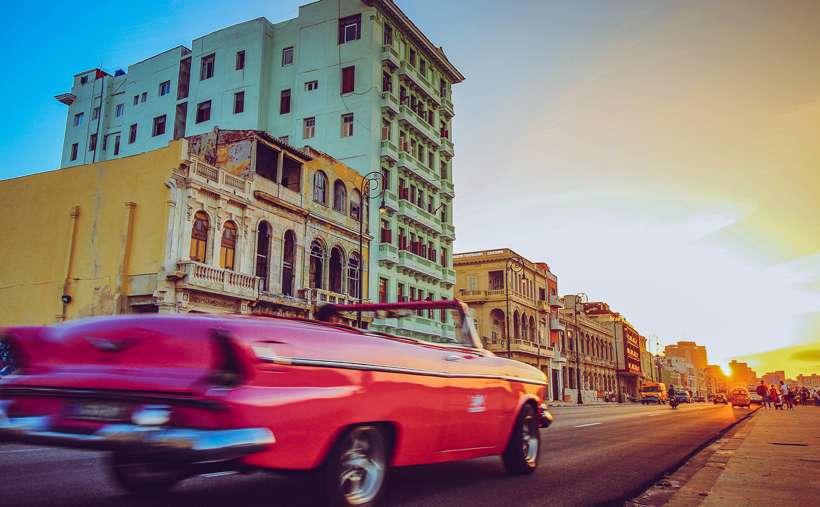 vintage car driving on street in cuba