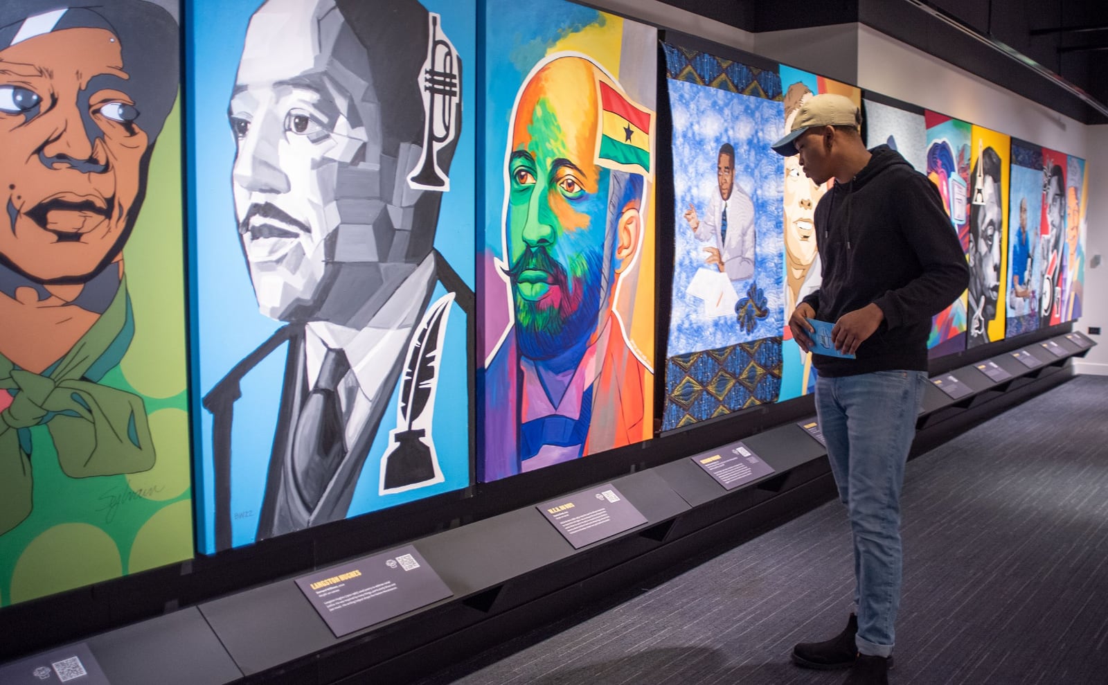 colorful display of posters of american writers of color at the american writers museum