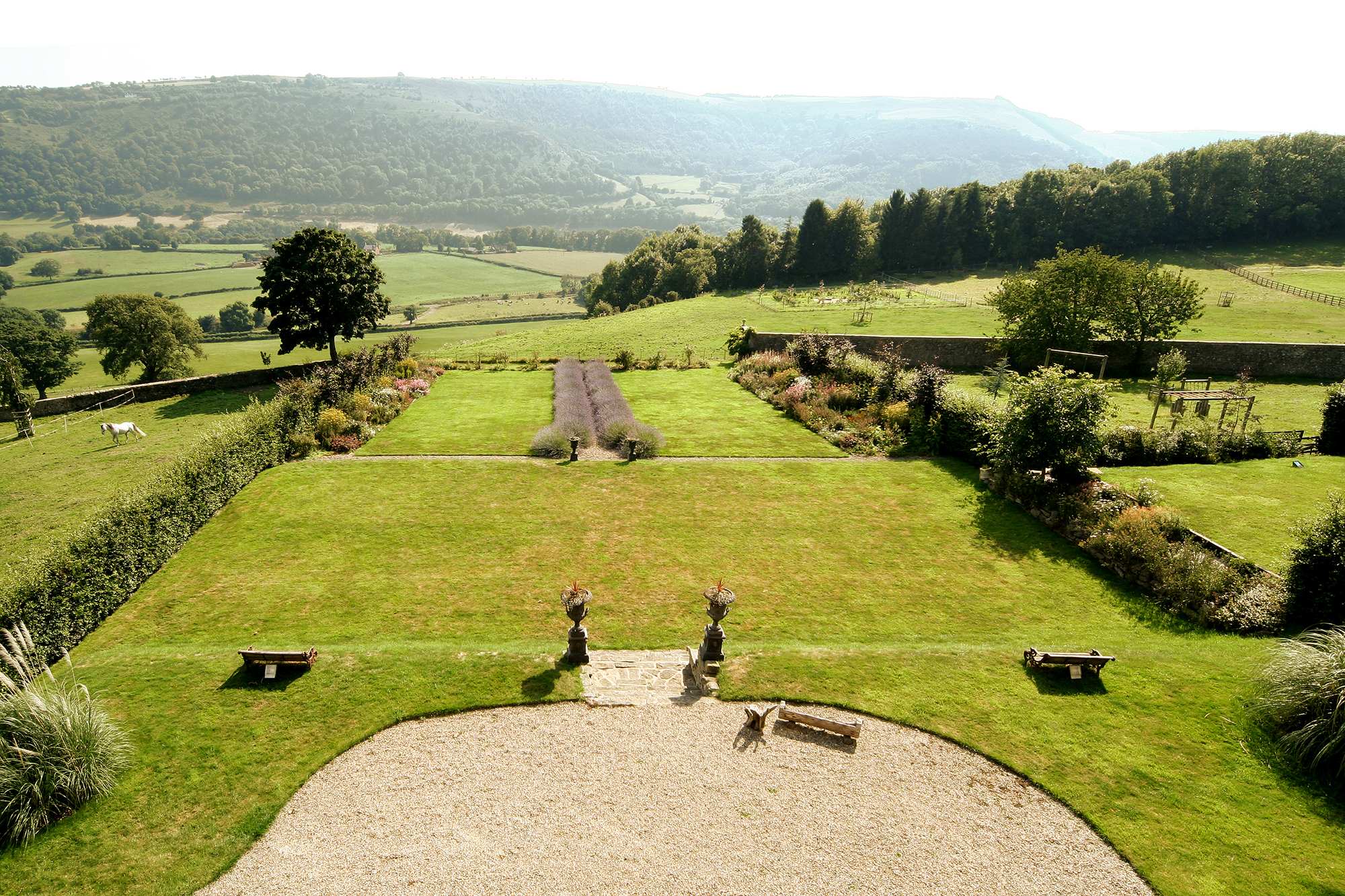 green lawn on a hilltop overlooking rolling green pastures