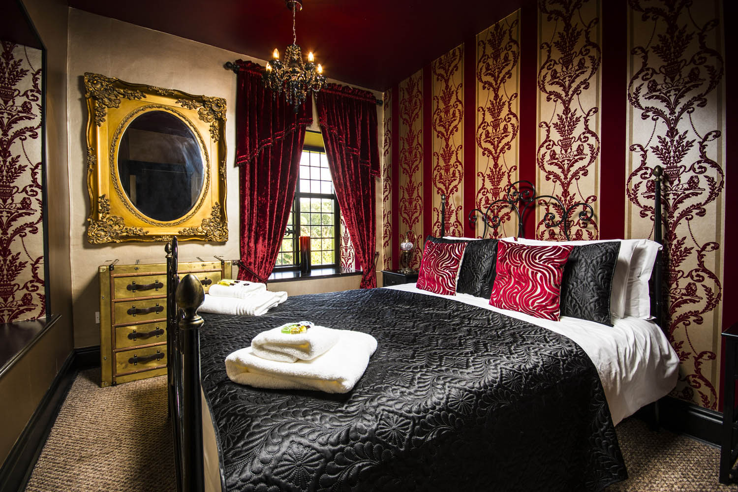 bedroom decorated in red and black