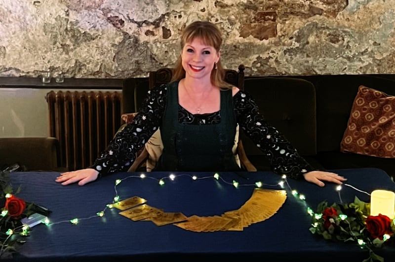 overhead photos of a cup of tea and an array of finger sandwiches