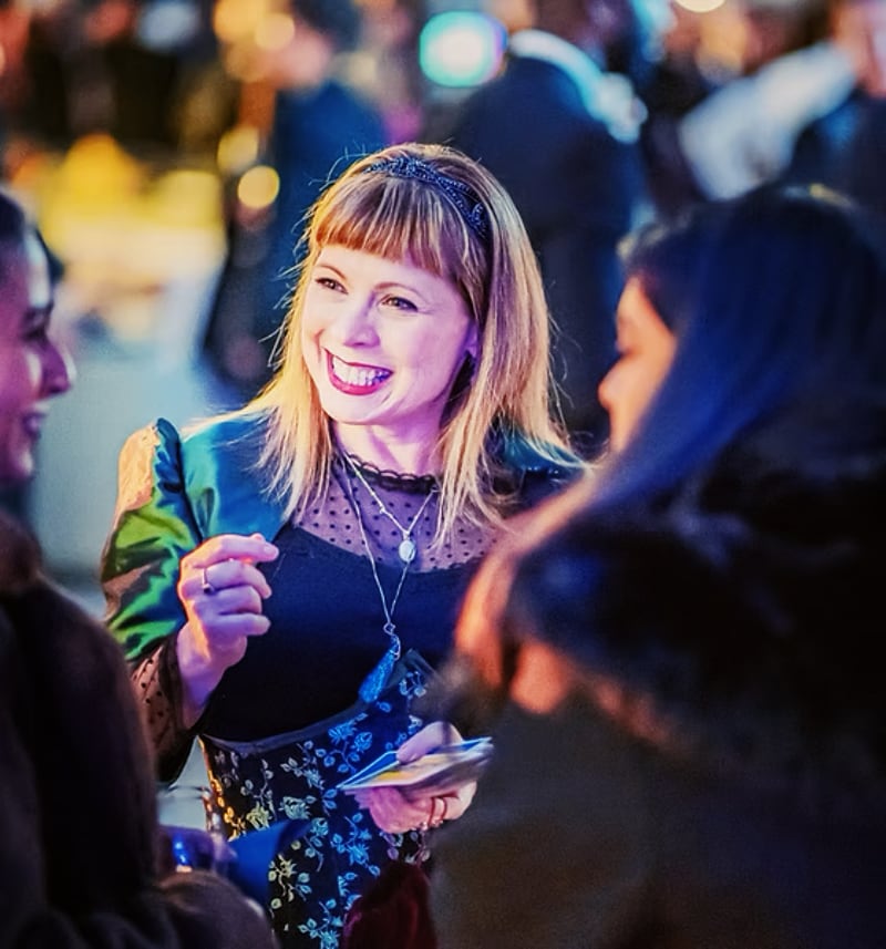 smiling woman in black lace dress