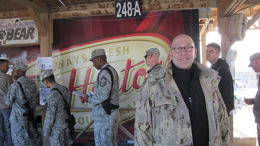 soldiers waiting in line to get into tim horton's in afghanistan