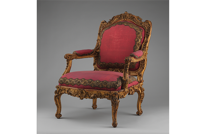 ornate antique chair upholstered in pink velvet