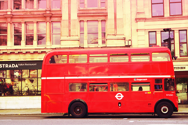 red double decker bus on a london street