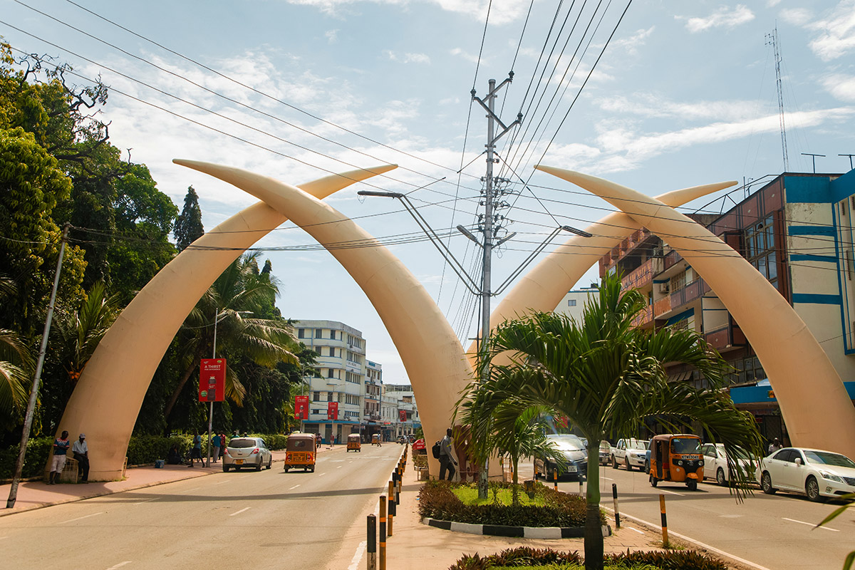 enormous elephant tusks forming an arch over a street in mombasa