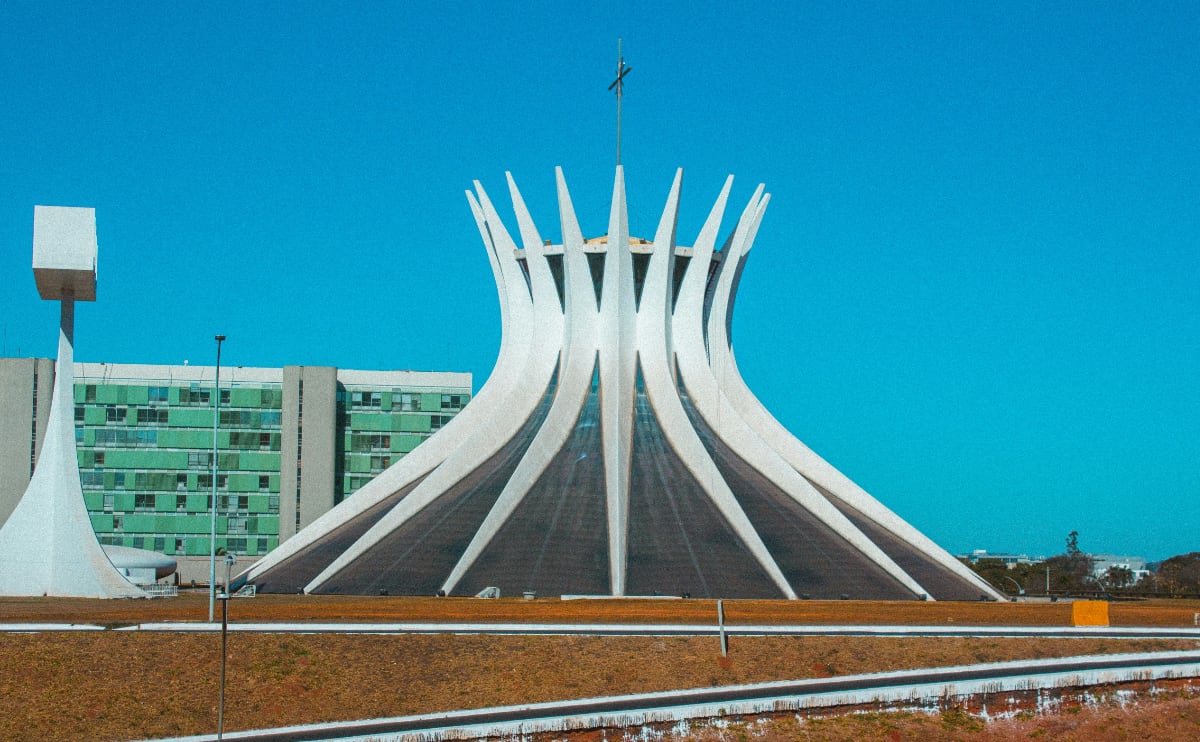 white spiky building under a bright blue sky in brasilia