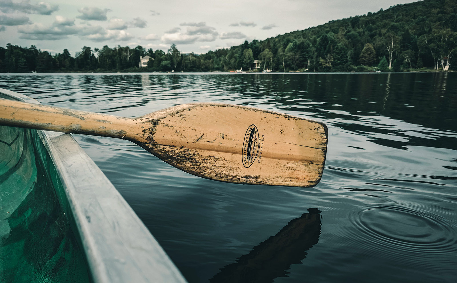  a canoe on a glassy lake