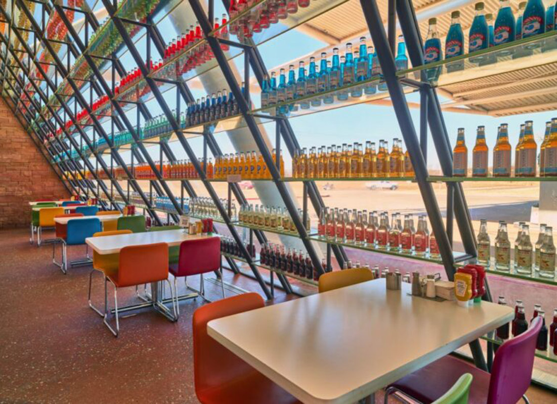  the inside of a colorful restaurant featuring soda pop bottles in arcadia, oklahoma
