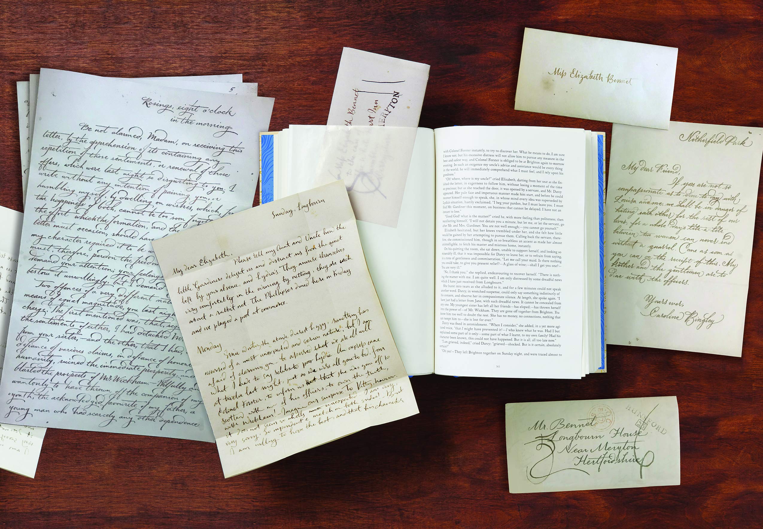handwritten letters on a wooden table