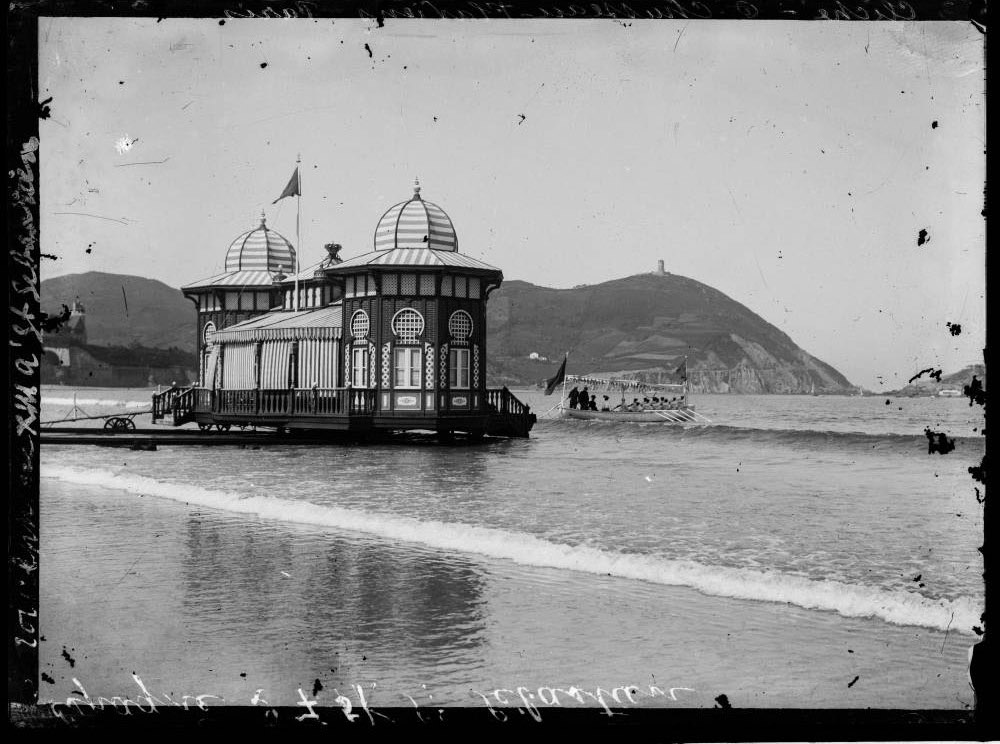  black and white image of victorian swimming hut in the water