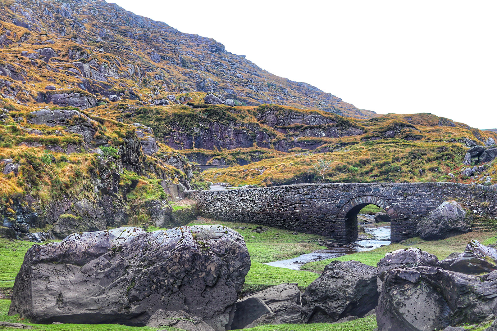 stone bridge and green hills at gap of dunloe, ireland
