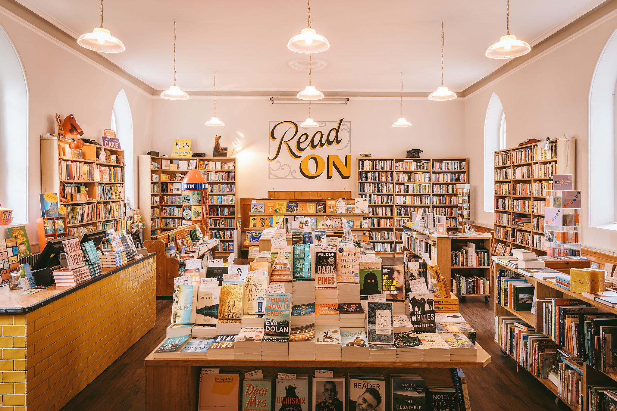  interior of forum books with bookshelves and display tables