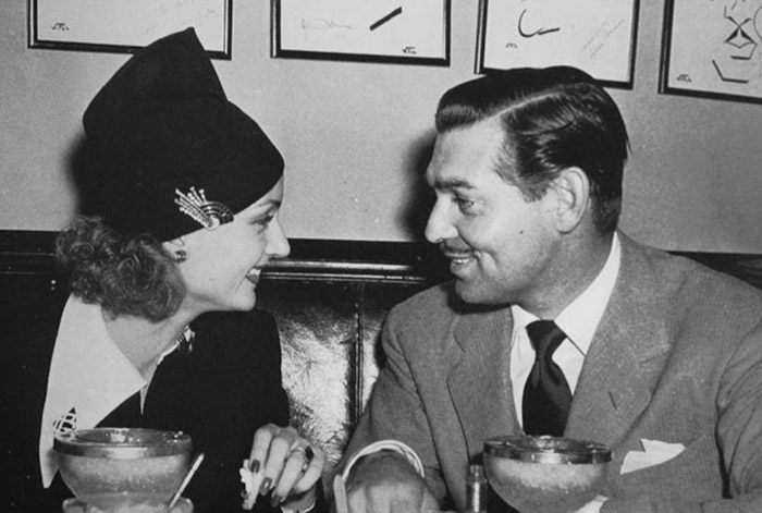  black and white photo of carole lombard and clark gable at the brown derby