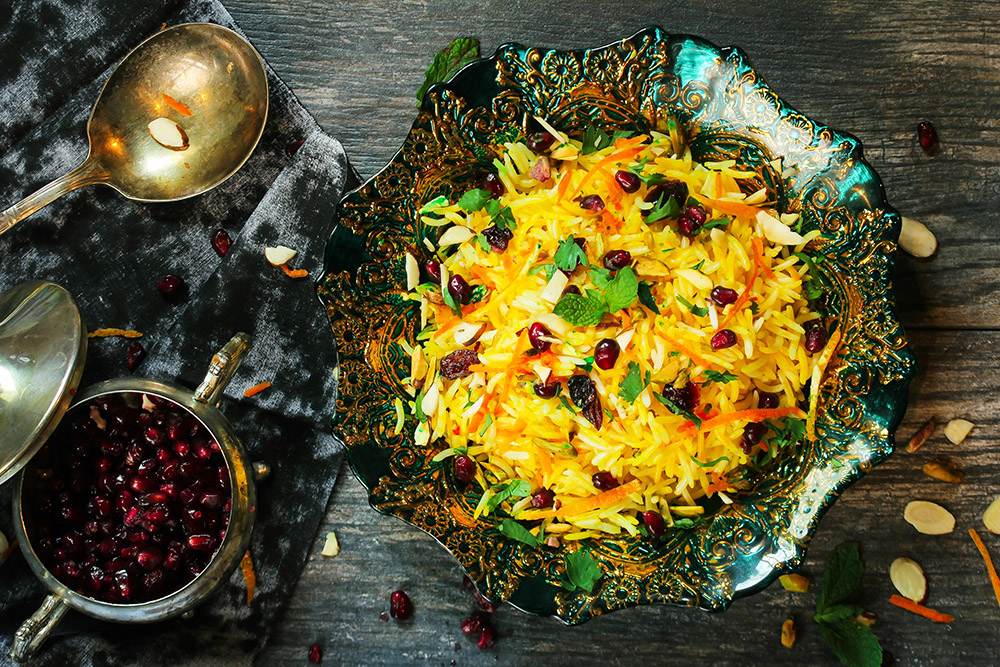 rice with pomegranate seeds in ornate bowl