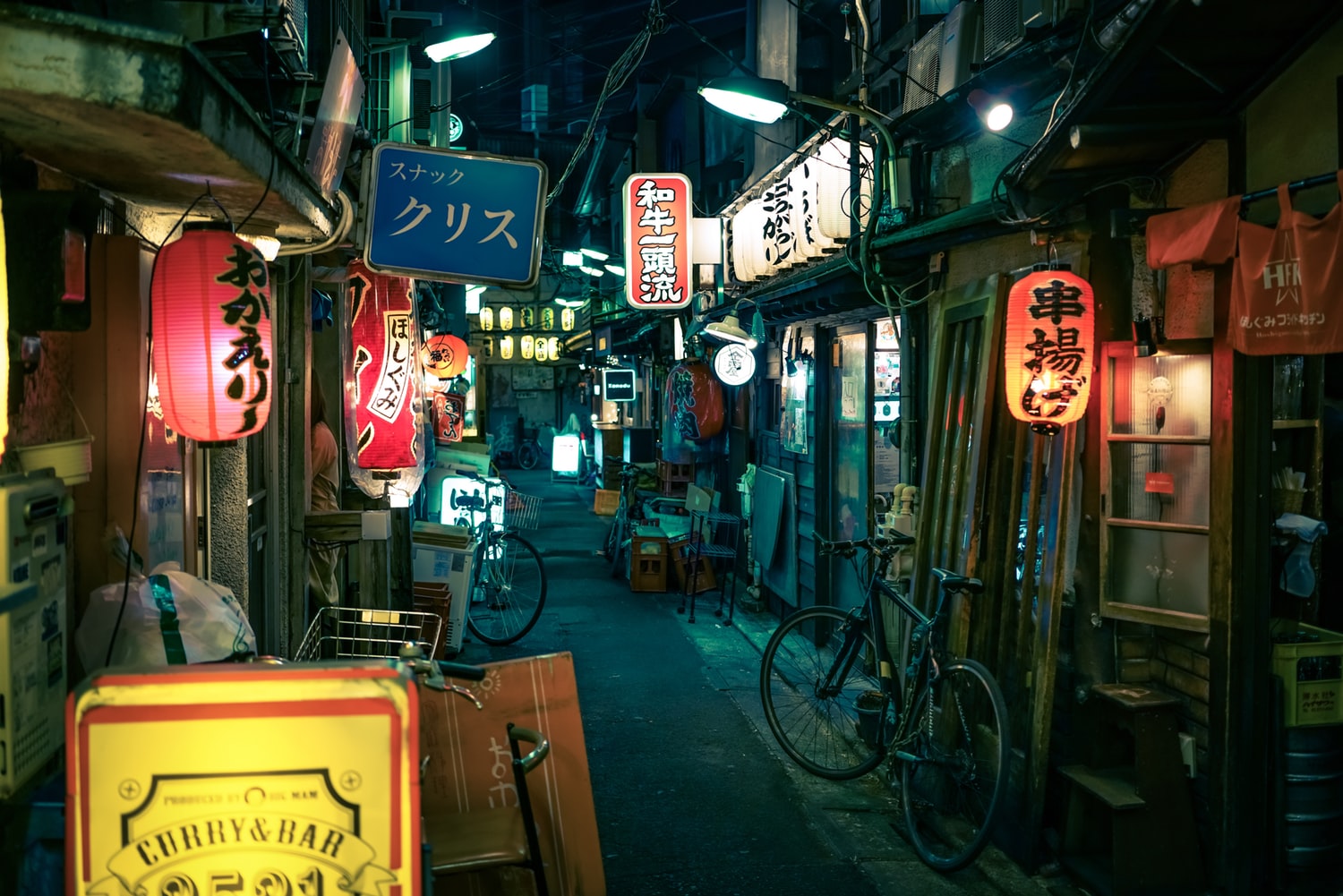 busy tokyo street with neon signs