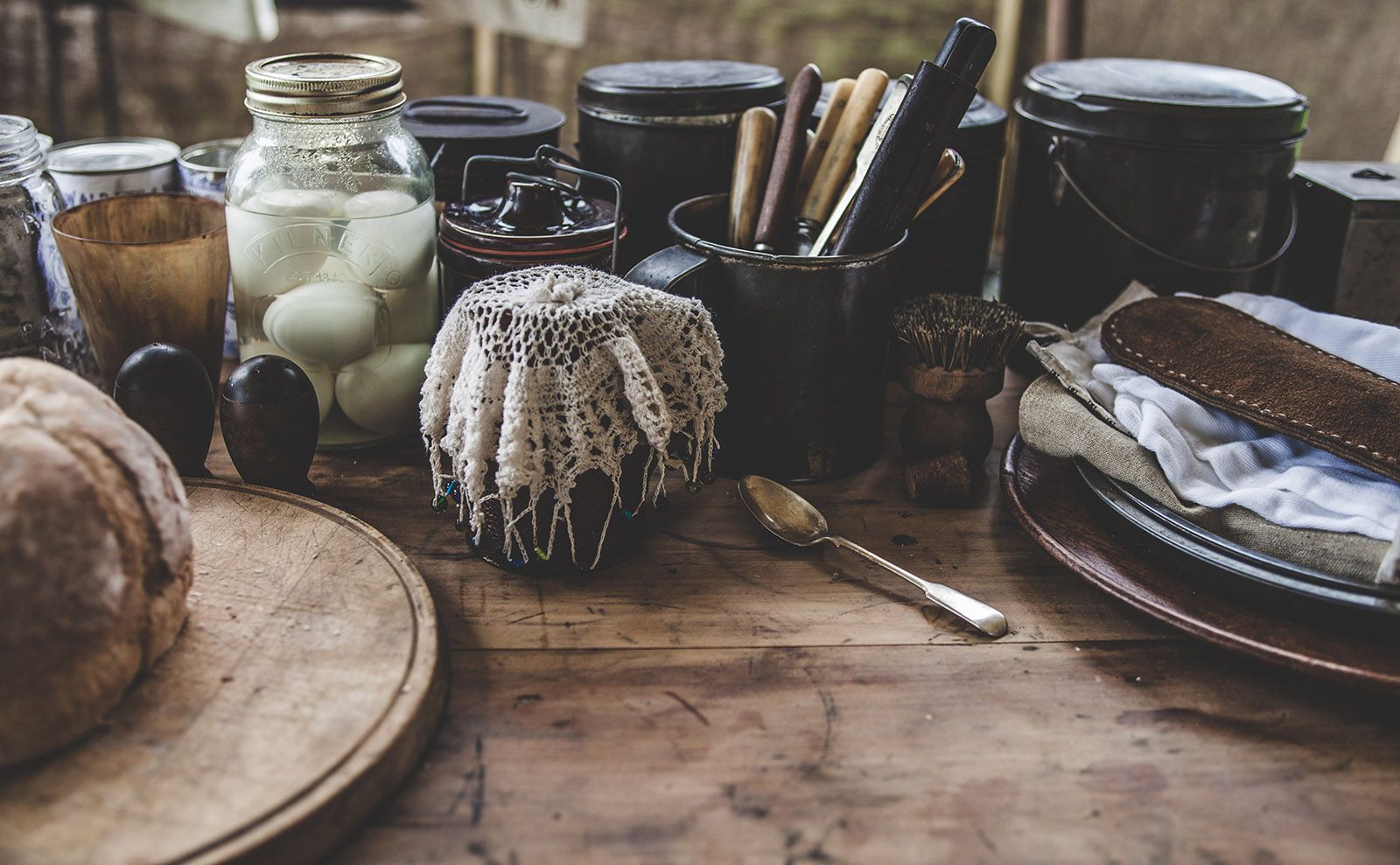 jars and plates on a wooden table