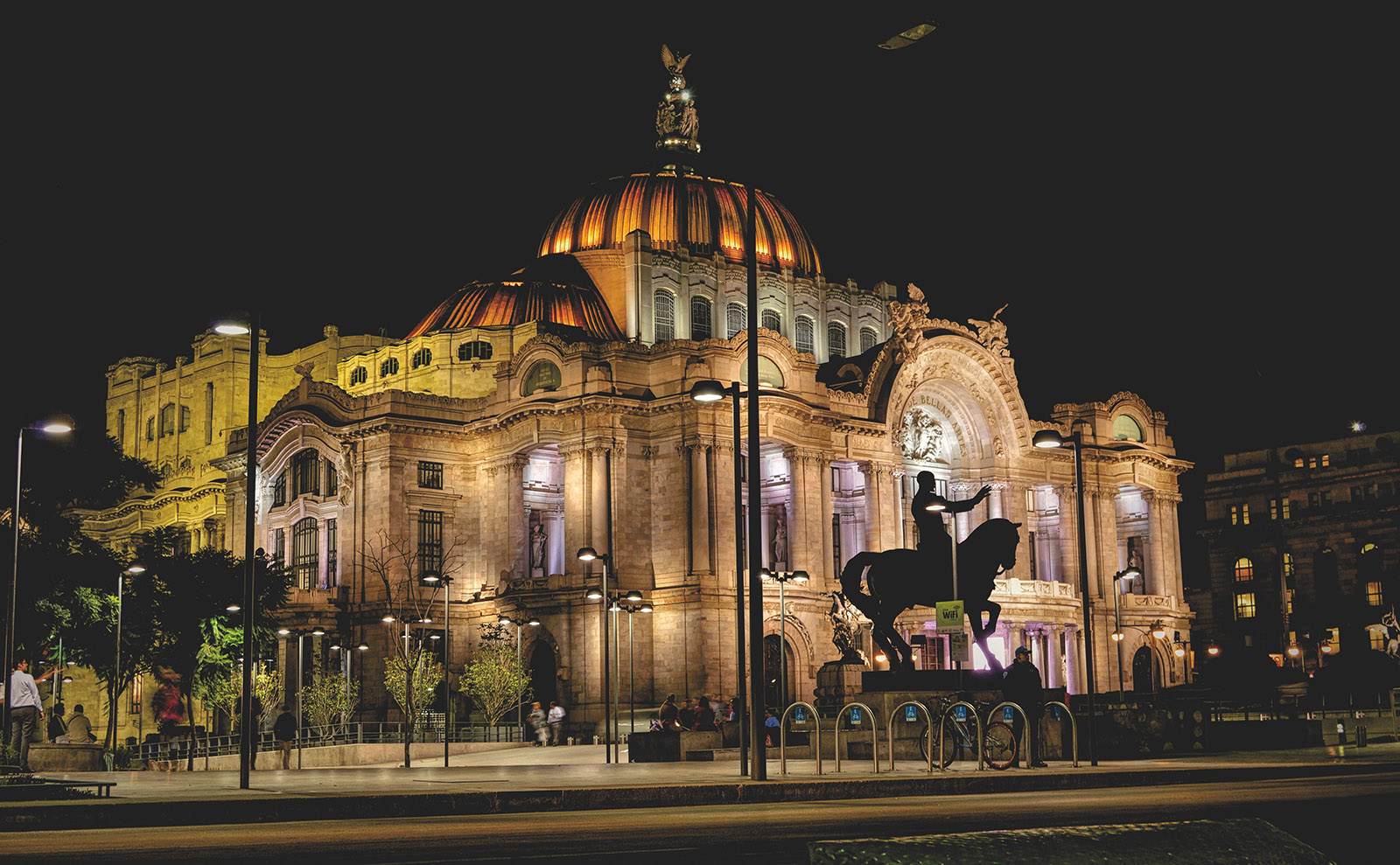 baroque building lit up at night in mexico city