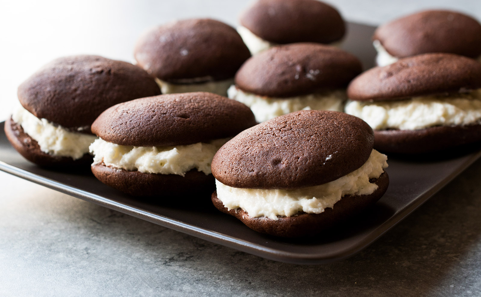 cream-filled whoopie pies on a wooden table