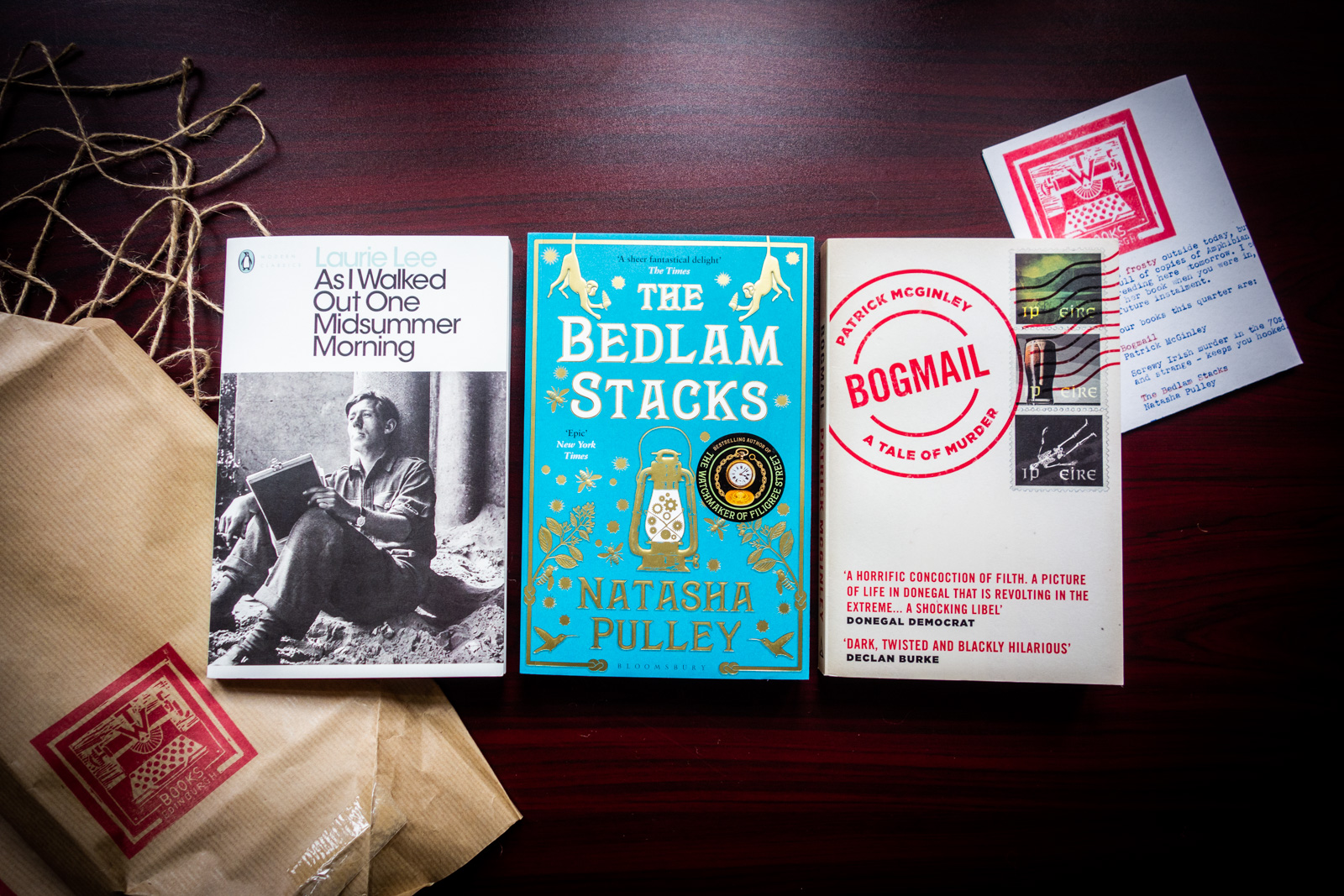 three paperback books on a table