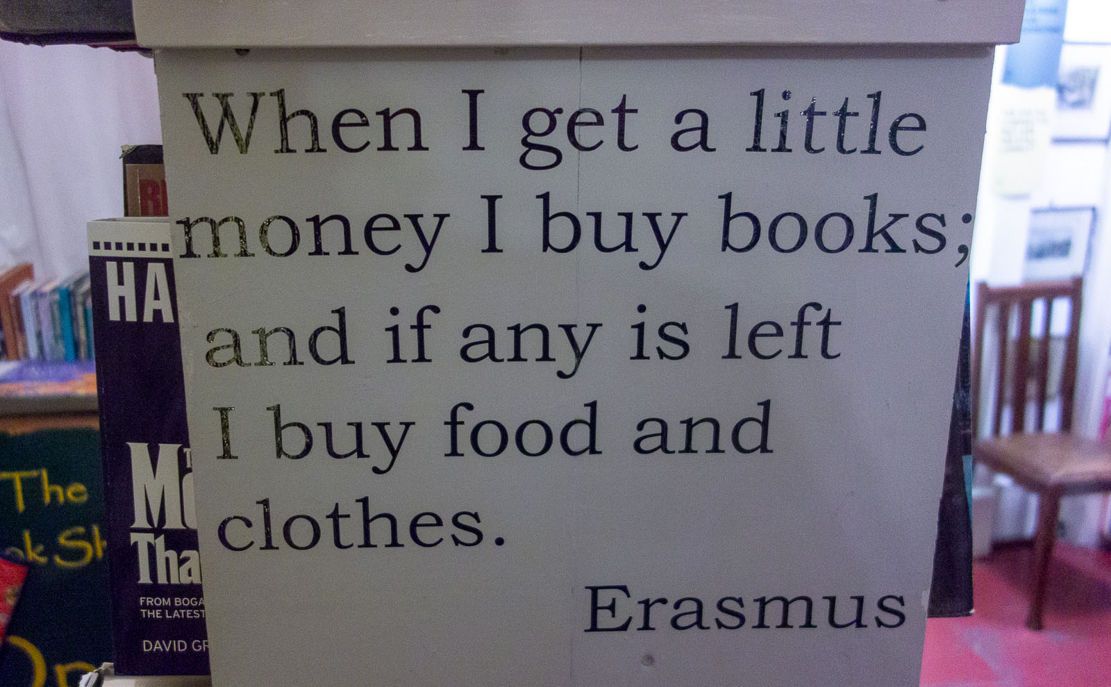 white sign with a quote from erasmus
